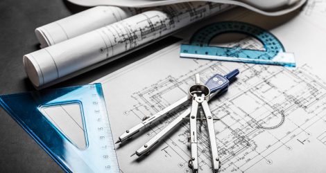 Construction planning drawings on black background