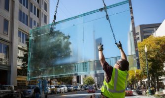 tower-crane-lifting-glass-panels-highrise-building-tower-crane-picture